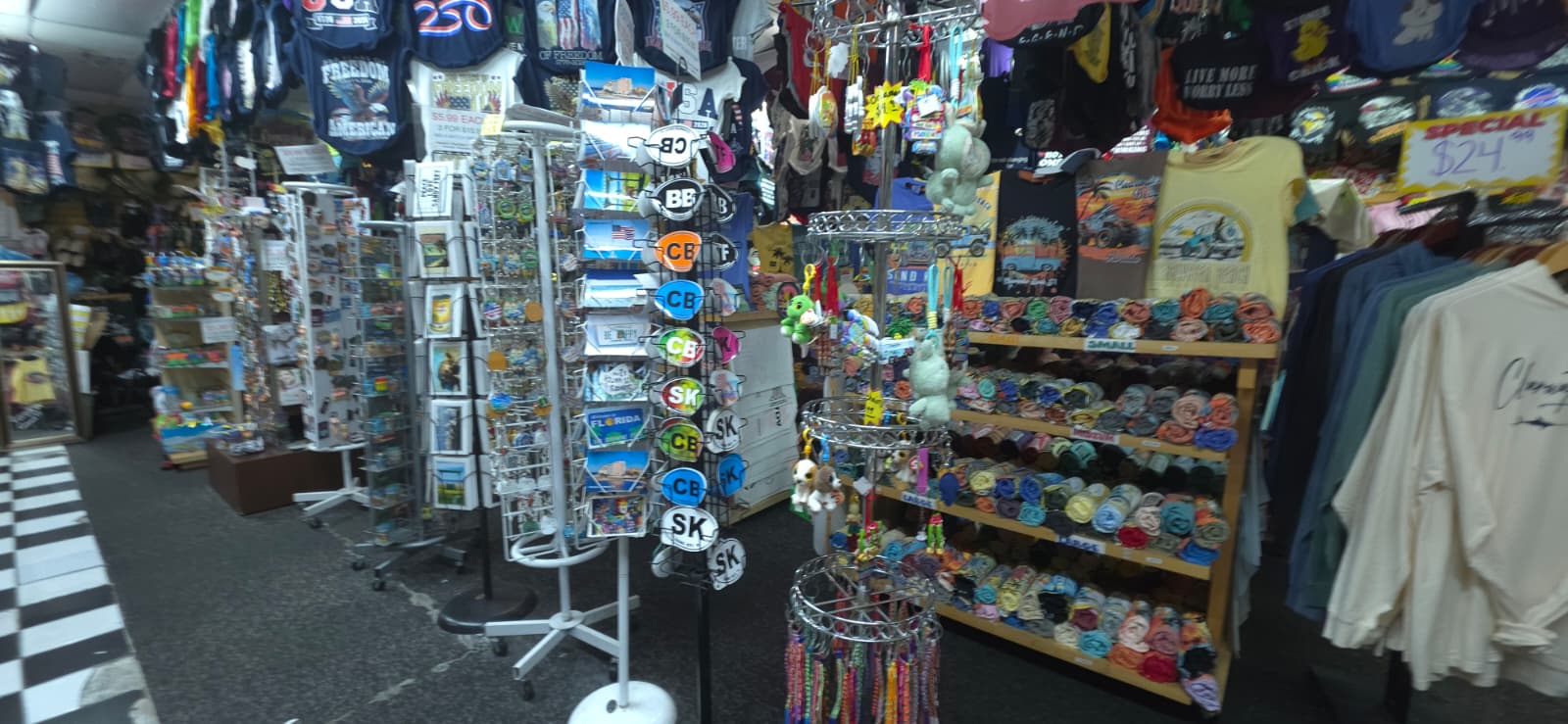 Interior aisles at Merry Mouse with souvenirs, hats, shirts, and beach gifts