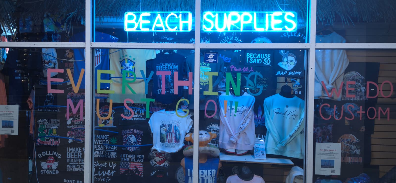 Merry Mouse storefront window with beach supplies and custom apparel